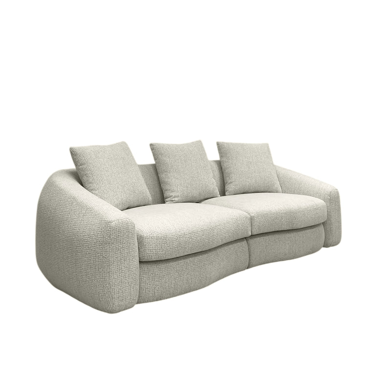 Biege sofa with three cushions on a white background