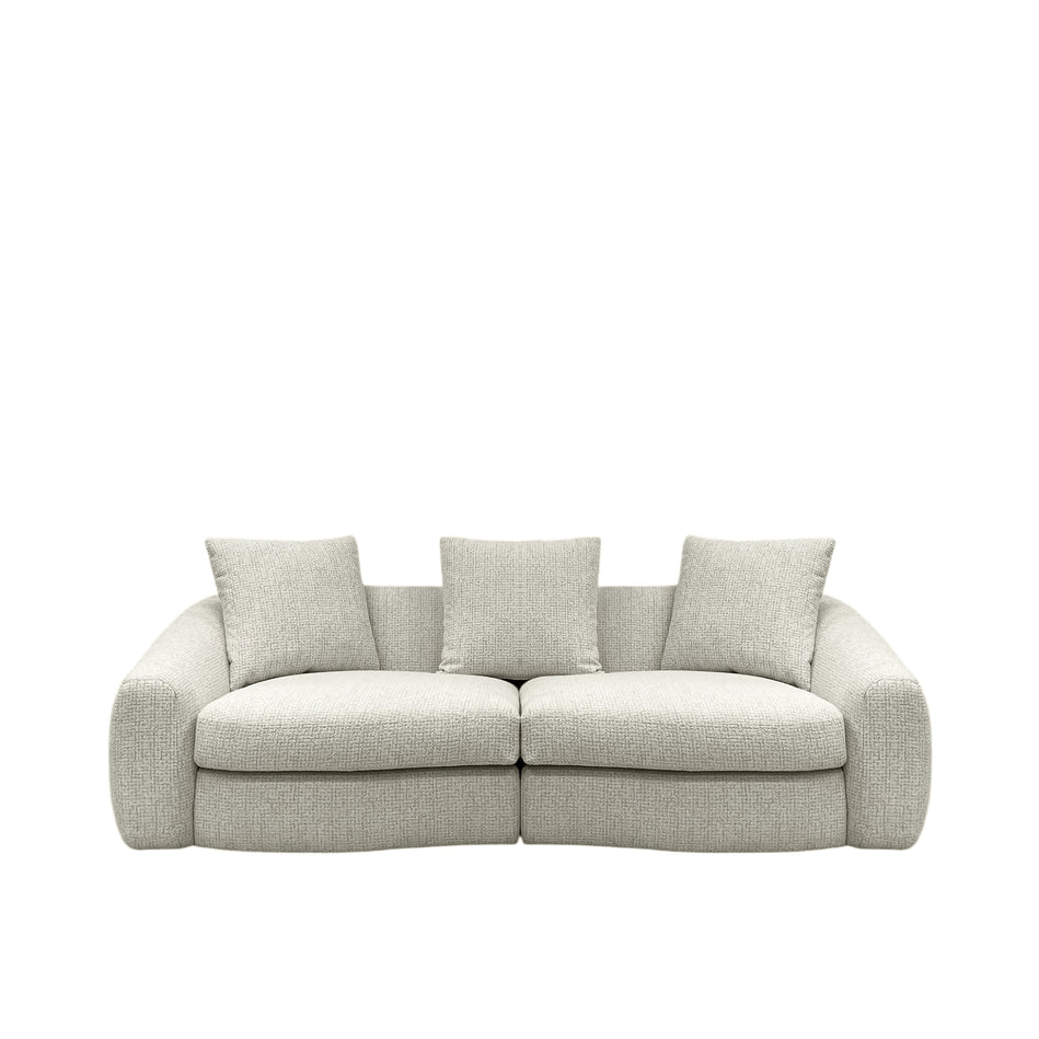 Beige sofa with three cushions on a white background